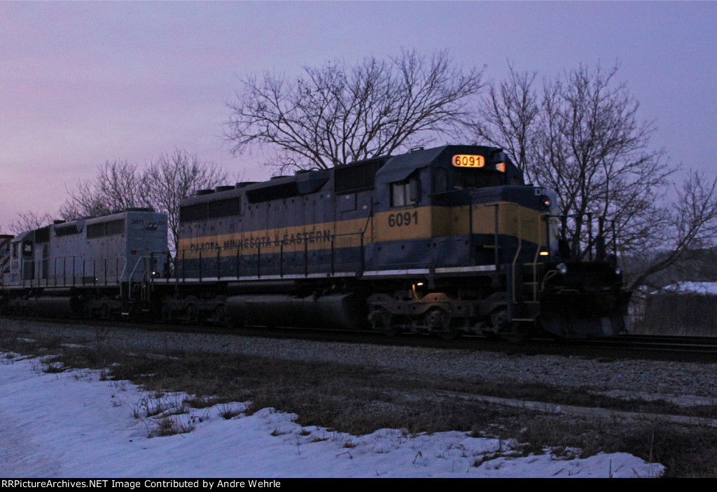 DME 6091 leads an evening 276 train